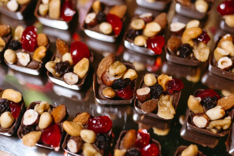 Delicious chocolate bites filled with assorted nuts and dried fruits on display.